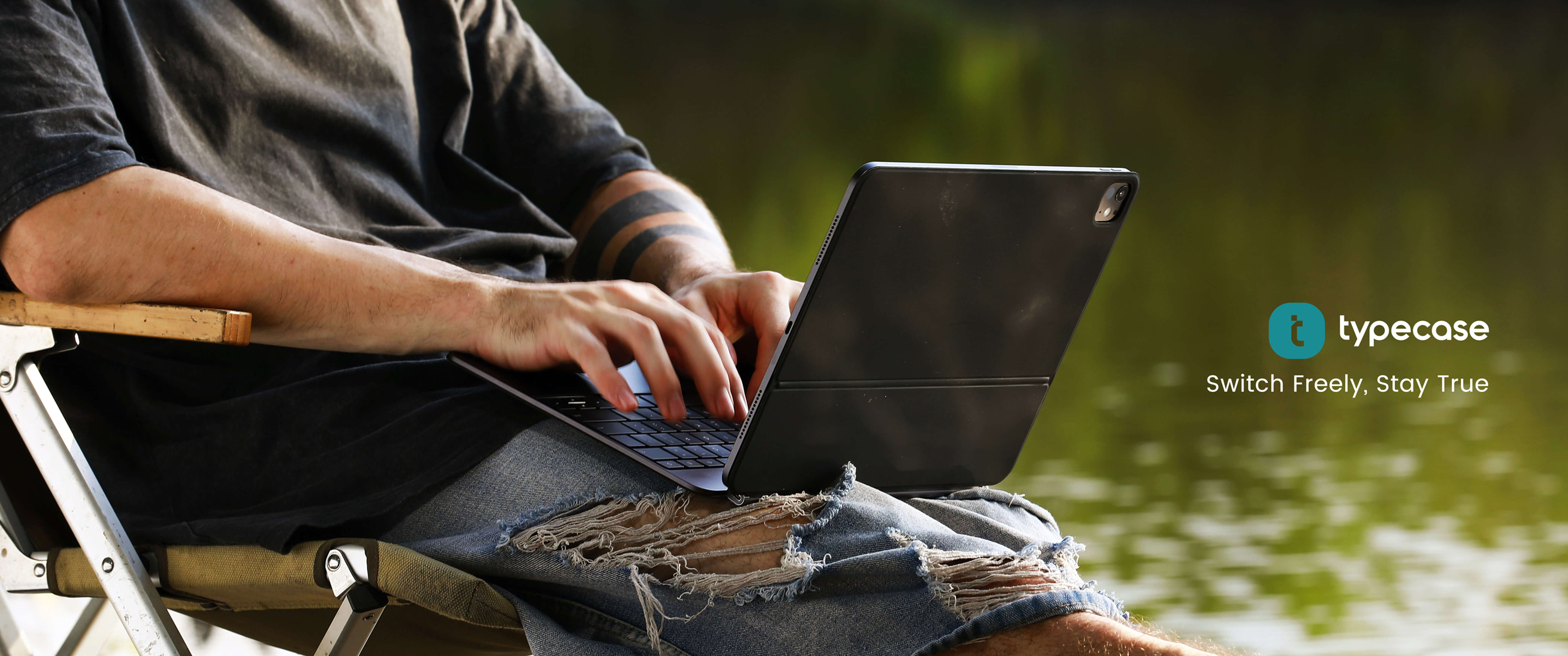 Leisurely_sitting_by_the_river_watching_an_iPad_with_a_Typecase-201T_iPad_keyboard_case-2.35:1